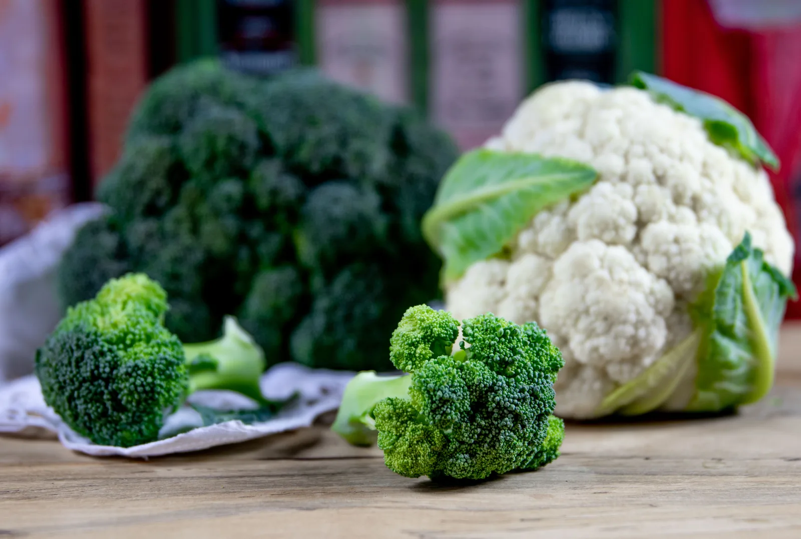 Broccoli and cauliflower on a wooden table